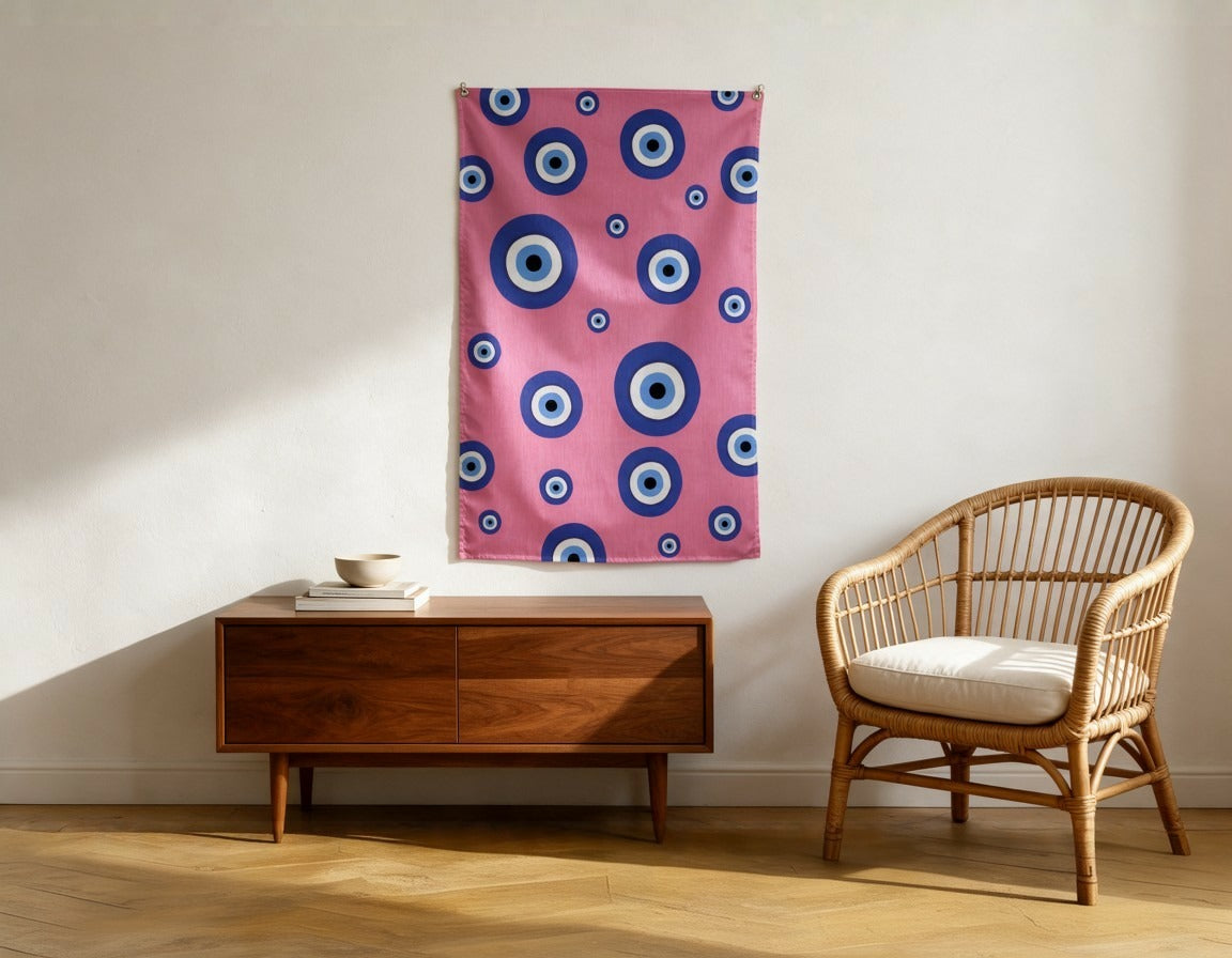 Evil Eye wall flag in a reading corner with a walnut console and rattan armchair