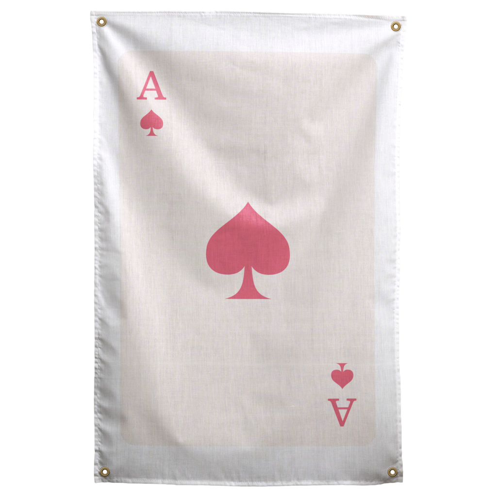 A large pink spade and matching ace letters and suit marks sit on a pale ivory playing-card field on a Wall Rebel fabric wall flag.