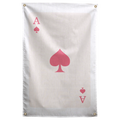 A large pink spade and matching ace letters and suit marks sit on a pale ivory playing-card field on a Wall Rebel fabric wall flag.