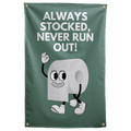 A smiling cartoon toilet roll sits below Always Stocked, Never Run Out lettering on this green Wall Rebel fabric wall flag.