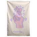 A pale pink hand outlined in purple crosses two fingers with radiating marks on this cream Wall Rebel fabric wall flag.