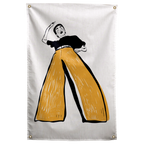 A black-and-white dancer raises one arm above oversized mustard-yellow trousers on a pale background on a Wall Rebel fabric wall flag.
