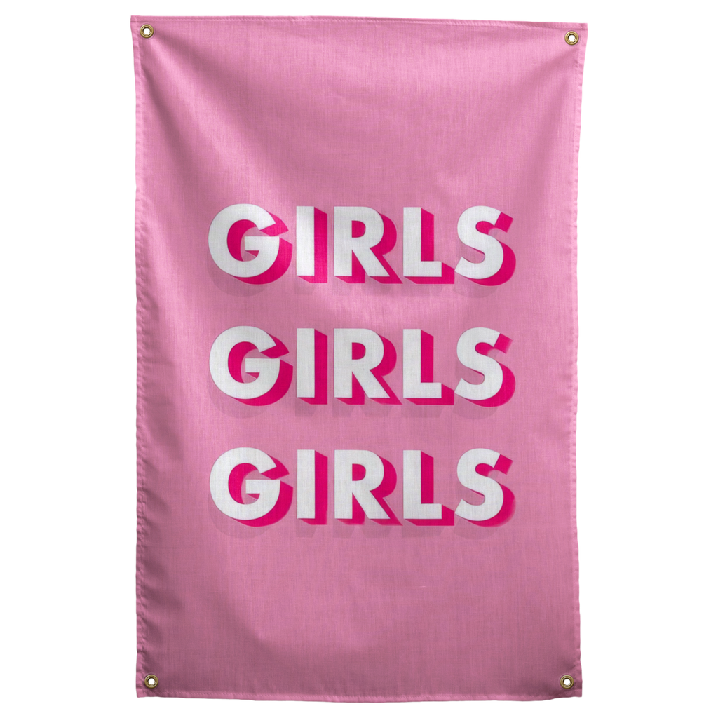 Three stacked GIRLS words cast white and pink dimensional shadows on a pink ground in this bold Wall Rebel fabric wall flag.