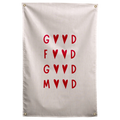 Red letters and pairs of hearts create a stacked Good Food Good Mood message on a pale background on a Wall Rebel fabric wall flag.