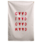 Red letters and pairs of hearts create a stacked Good Food Good Mood message on a pale background on a Wall Rebel fabric wall flag.