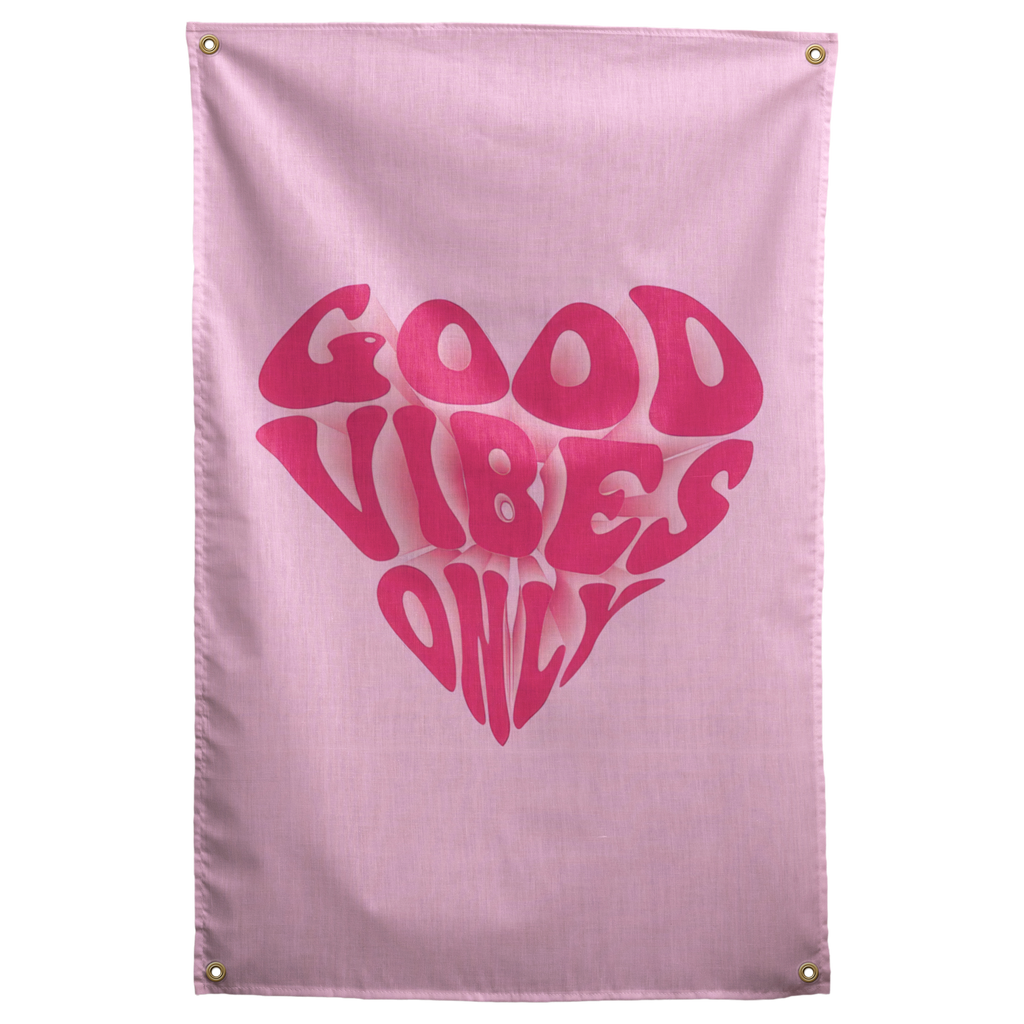 Rounded dark pink Good Vibes Only lettering forms a heart on pale pink in this playful Wall Rebel fabric wall flag.