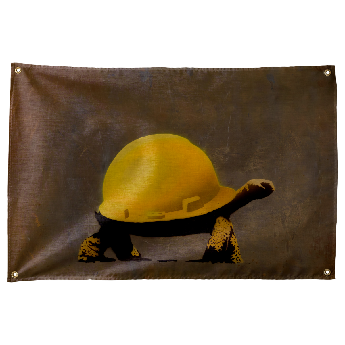 A tortoise wears an oversized yellow construction hard hat against brown-grey on this humorous horizontal Wall Rebel fabric wall flag.