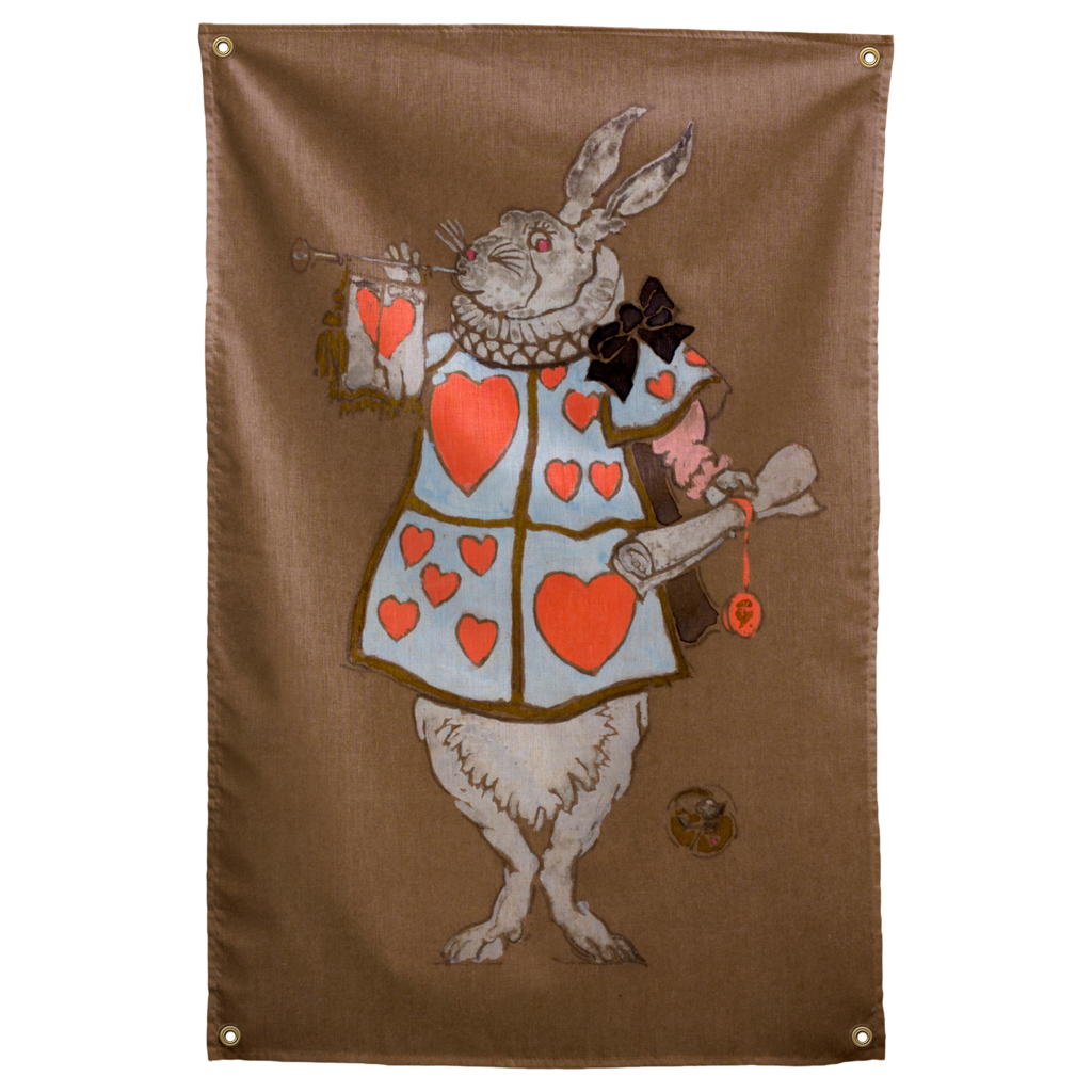 A white rabbit in a heart-covered tabard holds a trumpet and small scroll on brown in this Wall Rebel fabric wall flag.