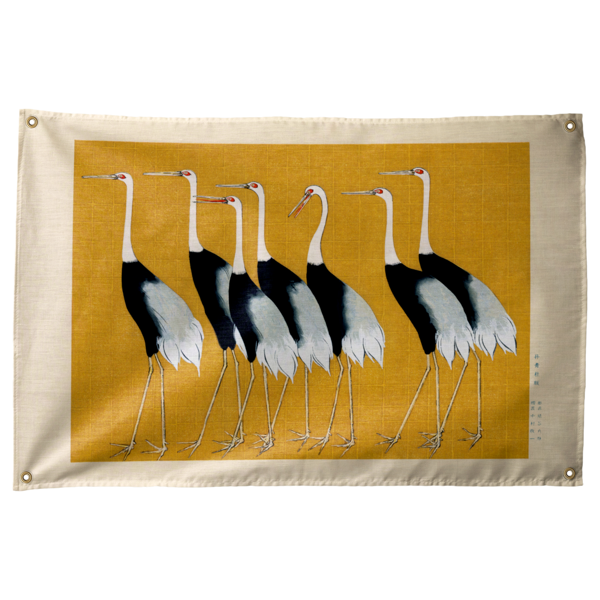 Black-and-white cranes stand across an ochre field, surrounded by a pale cream border on a Wall Rebel fabric wall flag.