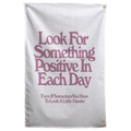 Muted pink Look For Something Positive In Each Day lettering stacks on white in this encouraging Wall Rebel fabric wall flag.