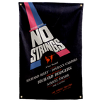 Slanted white NO STRINGS lettering crosses red and blue bands on black above musical theatre credits on a Wall Rebel fabric wall flag.
