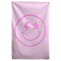 A pink smiley with a lightning-bolt eye and a star eye sits on pale pink in this playful Wall Rebel fabric wall flag.