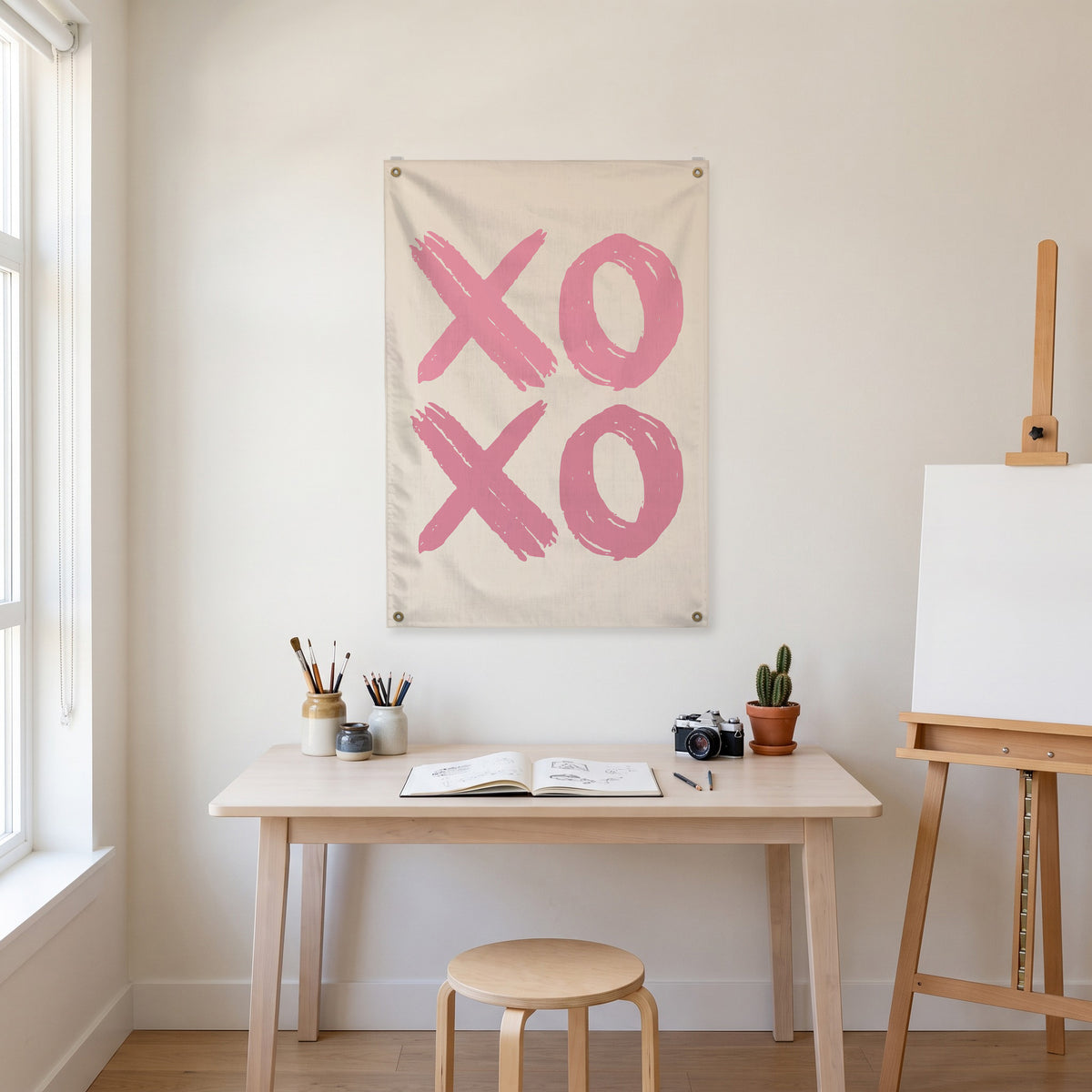 Pink XOXO Wall Flag in the art corner room mockup.