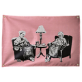 Two seated figures knit slogan blankets against pink in this humorous horizontal Punks Not Dead Wall Rebel fabric wall flag.