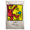A red outlined figure kicks towards a blue ball inside a yellow square filled with black motion marks on a Wall Rebel fabric wall flag.