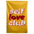 White and dark red Self Love Club lettering stacks with red shadows on golden yellow in this Wall Rebel fabric wall flag.