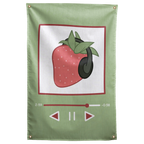 A strawberry in dark headphones appears inside a green music-player-style frame on this playful Wall Rebel fabric wall flag.