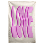 Oversized wavy pink LOVE letters cast darker shadows against cream on this bold typographic Wall Rebel fabric wall flag.