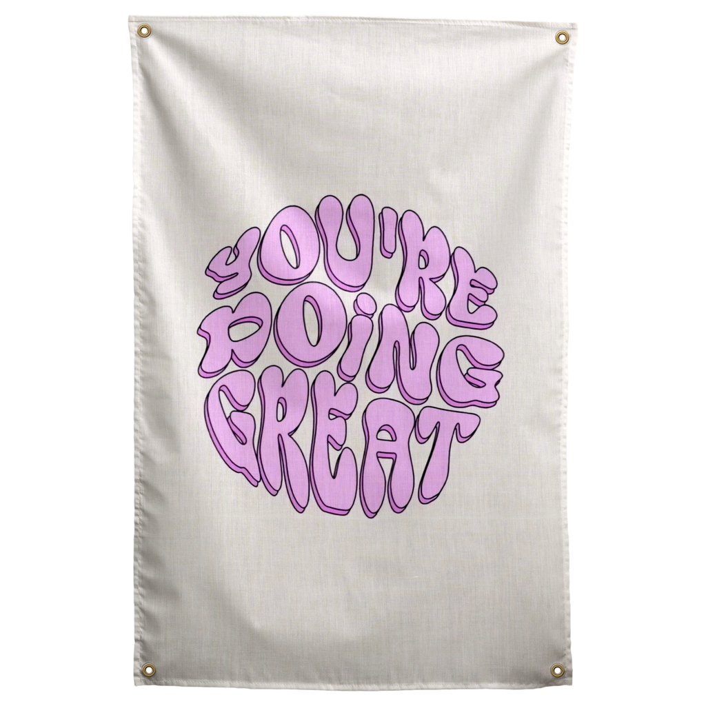 Rounded purple You're Doing Great lettering forms a compact circular shape on cream in this encouraging Wall Rebel fabric wall flag.
